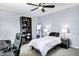 Bright bedroom features a full bookshelf, computer desk, and overhead fan at 8936 N 80Th Pl, Scottsdale, AZ 85258