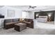 Open floor plan with living room with fireplace and connected main bedroom with ceiling fans at 8936 N 80Th Pl, Scottsdale, AZ 85258