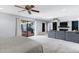 Spacious room has large glass doors to porch, plus fireplace and connected main bedroom at 8936 N 80Th Pl, Scottsdale, AZ 85258