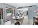 Dining area with tile floors, backyard views, and access to kitchen with breakfast bar at 8936 N 80Th Pl, Scottsdale, AZ 85258