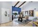 Dining area featuring vaulted ceilings, stylish lighting, and neutral decor at 8936 N 80Th Pl, Scottsdale, AZ 85258