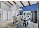 Dining area featuring vaulted ceilings, a decorative light fixture, and views of desert landscaping at 8936 N 80Th Pl, Scottsdale, AZ 85258