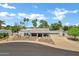 Attractive single-story home with desert landscaping, a circular driveway and a two car garage at 8936 N 80Th Pl, Scottsdale, AZ 85258