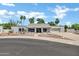 Single story home featuring desert landscaping, a tile roof, and a well-maintained front yard at 8936 N 80Th Pl, Scottsdale, AZ 85258