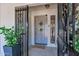 Inviting front entrance with an ornate door and tiled flooring at 8936 N 80Th Pl, Scottsdale, AZ 85258