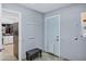The mudroom features neutral walls, a doggy door, and a transitional bench seat at 8936 N 80Th Pl, Scottsdale, AZ 85258