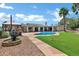 Inviting backyard oasis with sparkling pool, manicured lawn, and relaxing gazebo for outdoor enjoyment at 8936 N 80Th Pl, Scottsdale, AZ 85258
