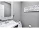 Powder room features a mirror, decorative accents, and a modern faucet at 8936 N 80Th Pl, Scottsdale, AZ 85258