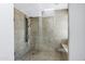 Modern shower with stone floors and walls, clear glass and multiple shower heads at 8936 N 80Th Pl, Scottsdale, AZ 85258