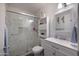 Updated bathroom featuring a glass-enclosed shower, modern vanity, and stylish fixtures at 9051 E Grandview Dr, Mesa, AZ 85207