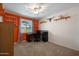 Bright bedroom featuring neutral walls, carpet, stylish shelving, and ample natural light at 9051 E Grandview Dr, Mesa, AZ 85207