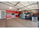 Spacious garage with ample storage cabinets, work bench and plenty of room for parking at 9051 E Grandview Dr, Mesa, AZ 85207