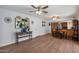 Open-concept living room and dining area with hardwood flooring, stylish decor, and plenty of space at 9051 E Grandview Dr, Mesa, AZ 85207
