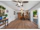 Open-concept living area with hardwood floors seamlessly connecting the living, dining, and kitchen spaces at 9051 E Grandview Dr, Mesa, AZ 85207