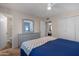 Serene main bedroom with a dresser, ample closet space and an attached bathroom at 9051 E Grandview Dr, Mesa, AZ 85207