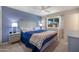 Serene main bedroom with carpet floors, stylish nightstands, and a window showcasing outdoor scenery at 9051 E Grandview Dr, Mesa, AZ 85207