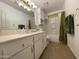 This bathroom has a bath, a sink with drawers, and a marble countertop at 9221 N 48Th Dr, Glendale, AZ 85302