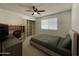 A contemporary bedroom complete with a workstation, and closet space at 9221 N 48Th Dr, Glendale, AZ 85302
