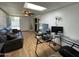Versatile bonus room with a comfortable seating area and access to the outdoors at 9221 N 48Th Dr, Glendale, AZ 85302