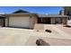 Charming single-story home with a two-car garage, desert landscaping, and brick accents at 9221 N 48Th Dr, Glendale, AZ 85302
