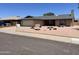 Charming single-story home featuring desert landscaping, attached garage, and a chimney at 9221 N 48Th Dr, Glendale, AZ 85302