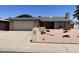 Charming single-story home with a well-maintained front yard and attached garage at 9221 N 48Th Dr, Glendale, AZ 85302