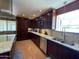 Well-appointed kitchen with wood cabinetry, stainless steel appliances, and granite countertops at 9221 N 48Th Dr, Glendale, AZ 85302