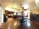 Open-concept kitchen with stainless steel appliances, granite countertops, and wood cabinets at 9221 N 48Th Dr, Glendale, AZ 85302