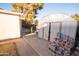 Backyard featuring a shed, concrete patio, and landscaping offering relaxation or storage options at 937 E 6Th Ave, Mesa, AZ 85204