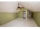 Attic bedroom with ceiling fan and storage alcove at 937 E 6Th Ave, Mesa, AZ 85204