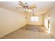 Bright bedroom with two ceiling fans and a window AC unit at 937 E 6Th Ave, Mesa, AZ 85204