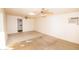 Bright bedroom with two ceiling fans and a window AC unit at 937 E 6Th Ave, Mesa, AZ 85204