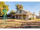 Charming single-story home with front yard, landscaping and unique decorative windmill at 937 E 6Th Ave, Mesa, AZ 85204
