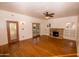 Inviting living room boasts beautiful wood floors, fireplace and French doors at 937 E 6Th Ave, Mesa, AZ 85204