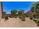 Gravel backyard featuring a seating area, desert landscaping, and privacy walls at 9535 E Tupelo Ave, Mesa, AZ 85212