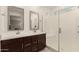 Modern bathroom featuring a double sink vanity, walk-in shower, and bright natural lighting at 9535 E Tupelo Ave, Mesa, AZ 85212