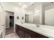 Bathroom with double sinks, undermount cabinets and access to the laundry room at 9535 E Tupelo Ave, Mesa, AZ 85212