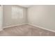 Comfortable bedroom with neutral walls, carpet, and a window at 9535 E Tupelo Ave, Mesa, AZ 85212