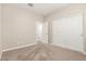 Bedroom with large closet, neutral carpet and walls, and a view into the hall at 9535 E Tupelo Ave, Mesa, AZ 85212