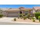 Single story house with a well-kept front yard, two-car garage, and a tile roof at 9535 E Tupelo Ave, Mesa, AZ 85212