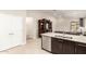 Bright kitchen with stainless steel appliances, a breakfast bar, and an open layout at 9535 E Tupelo Ave, Mesa, AZ 85212