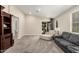 Relaxing living room area featuring plush seating, neutral decor, and lots of light from the sliding glass door at 9535 E Tupelo Ave, Mesa, AZ 85212