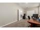 Office space with views to the laundry room and large closet with sliding doors at 9535 E Tupelo Ave, Mesa, AZ 85212