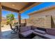 Covered patio with an outdoor sofa set, table, and grill for outdoor enjoyment at 9535 E Tupelo Ave, Mesa, AZ 85212