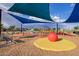Community playground featuring a variety of play equipment and colorful surfaces at 9535 E Tupelo Ave, Mesa, AZ 85212