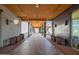 Covered walkway featuring modern design, lush potted plants, and inviting ambiance for pedestrians at 9535 E Tupelo Ave, Mesa, AZ 85212