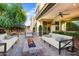 Relaxing back patio with cozy seating and a stylish fire pit, perfect for outdoor living at 970 W Zion Way, Chandler, AZ 85248