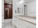 Modern bathroom boasting a double sink vanity, elegant fixtures, and a tiled shower/tub, offering a spa-like retreat at 970 W Zion Way, Chandler, AZ 85248