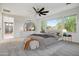 Bright and airy bedroom with a plush bed, ceiling fan, and elegant decor at 970 W Zion Way, Chandler, AZ 85248