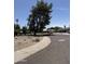 Residential street view featuring desert landscaping, mature trees, and diverse home styles at 1022 E Keim Dr, Phoenix, AZ 85014